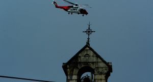 Irish Coast Guard helicopter performs a flyover at the funeral of Capt Dara Fitzpatrick. Photograph: Cyril Byrne/The Irish Times 