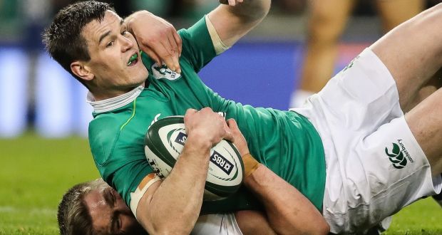 Johnny Sexton is tackled by England’s Owen Farrell  at the  Aviva Stadium. Photograph: Billy Stickland/Inpho 