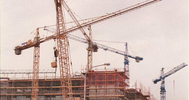 Building boom: cranes towering over a construction site on the Dublin quays. Photograph: Alan Betson