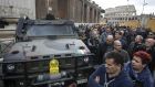 A military vehicle guards as a rally leaves from the  Colosseum  for a national strike of taxi drivers  in Rome on Thursday. Photograph: Angelo Carconi/EPA