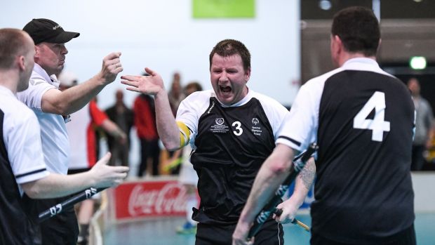 George Fitzgerald, (3), a member of Waterford Special Olympics Club, from John’s Hill, is congratulated after he scoring a goal during the Floorball play-off game with Switzerland in Graz. Photograph: Ray McManus/Sportsfile