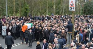 The  coffin of Martin McGuinness is carried through  Derry at his funeral on Thursday. Photograph: Alan Betson 