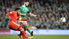 Ireland’s Shane Long clashes with Ashley Williams of Wales during their World Cup qualifier. Photo: Ryan Byrne/Inpho