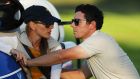 Erica Stoll and Rory McIlroy of Europe look on during afternoon fourball matches of the 2016 Ryder Cup. Photograph: Getty Images