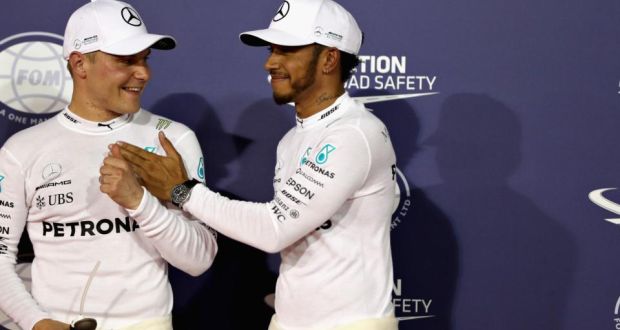  Lewis Hamilton congratulates his   Mercedes team-mate  Valtteri Bottas after the Finn claimed his first pole position at the  Bahrain Grand Prix. Photograph:  Mark Thompson/Getty Images