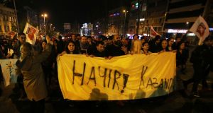 Supporters of ‘’No’’ side take part in a protest as they hold a banner which reads in Turkish “no” in Istanbul. Photograph: Petros Karadjias/AP