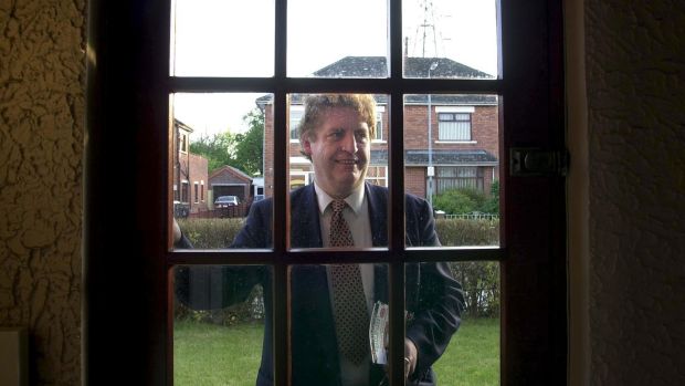 The SDLP’s Alasdair McDonnell at a door in Belfast while canvassing in 2015.