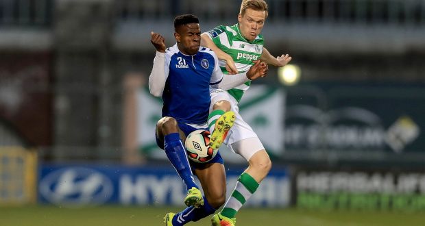 Limerick’s Chiedozie Ogbene with Simon Madden of Shamrock Rovers. Photo: Donall Farmer/Inpho