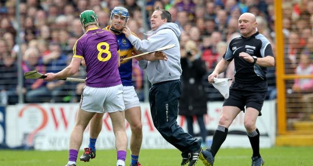 Wexford manager Davy Fitzgerald and Aidan Nolan clash with Tipperary’s Jason Forde  at Nowlan Park. Photograph: Ryan Byrne/Inpho 