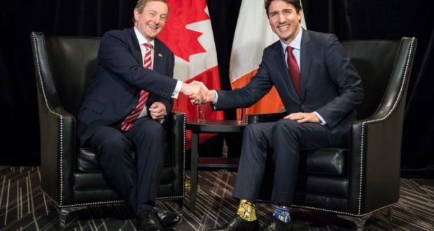Taoiseach Enda Kenny shakes hands with Canada’s prime minister Justin Trudeau (note Star Wars socks) ahead of  their meeting on Thursday in Montreal. Photograph: Paul Chiasson/The Canadian Press/AP