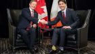 Taoiseach Enda Kenny shakes hands with Canada’s prime minister Justin Trudeau (note Star Wars socks) ahead of  their meeting on Thursday in Montreal. Photograph: Paul Chiasson/The Canadian Press/AP