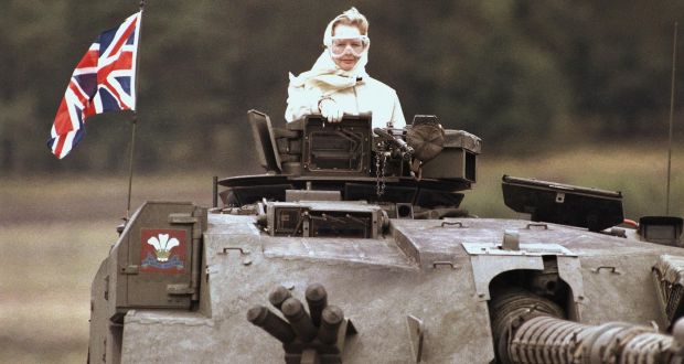 British Prime Minister Margaret Thatcher stands in a British tank during a visit to British forces in  Germany. on Sept. 17, 1986. (AP Photo/Jockel Fink) 