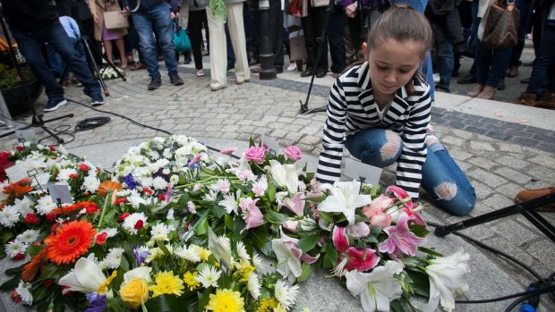 Rosanna Grace (10) from Malahide whose grandmother Breda died in the Dublin bombings during the wreath-laying ceremony in Talbot Street, Dublin. Photograph: Gareth Chaney Collins