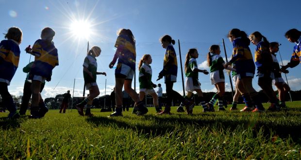 Members of the O’Tooles and Castleknock teams shake hands after a game during an U10 football tournament in Clontarf. “Girls’ involvement in team sports tends to fall off a cliff ‘right at the time when they would benefit most’.” Photograph: Alan Betson/The Irish Times