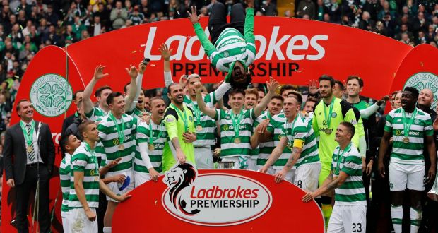 Champions Celtic celebrate after their final day win over Hearts. Photograph: Russell Cheyne/Reuters 