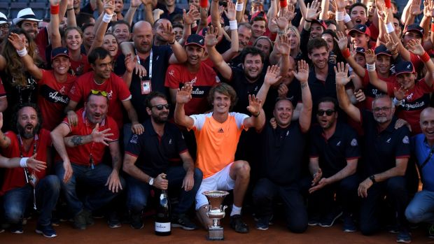 Alexander Zverev celebrates with tournament staff after beating Novak Djokovic to win the Italian Open in Rome. Photograph: Gareth Copley/Getty
