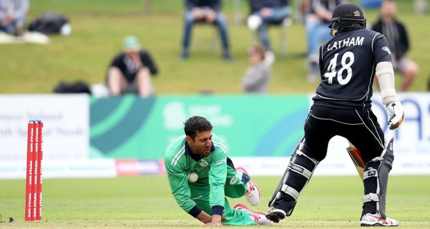 Ireland’s Simi Singh fields off his own bowling during the Tri-Nations Series match against New Zealand at Malahide. Photograph:  Oisin Keniry/Inpho