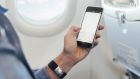 Most airlines charge for wifi, or it may be free in business class. Photograph: Getty Images/Westend61