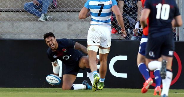   England’s Denny Solomona celebrates after scoring a try to win the match. Photograph: Marcos Brindicci/Reuters