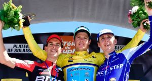 Denmark’s Jakob Fuglsang, second-placed Australia’s Richie Porte  and third-placed Ireland’s Daniel Martin celebrate on the podium. Photograph: Getty Images