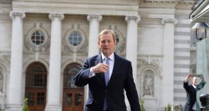 Taoiseach Enda Kenny leaving Government buildings to go to Áras an Uachtaráin to submit his resignation to President Michael D Higgins. Photograph: Cyril Byrne 