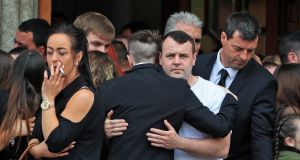 Family and friends console each other after the funeral Mass  of Michael Keogh this morning at St Francis Xavier Church, Gardiner Street, Dublin. Photograph: Colin Keegan/Collins Dublin