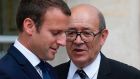 French president Emmanuel Macron  speaks with foreign minister Jean-Yves Le Drian: Mr Macron has achieved his goal of splitting the conservatives. Photograph: Geoffroy van der Hasselt/AFP/Getty 