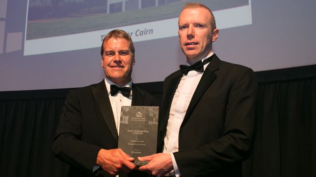 Jeremy English, Sales Director, Södra, presents the Single House Building of the Year to Garbhan Doran, Broadstone Architects.