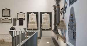 A complete wall of monuments was kept because the artwork was so deeply embedded into it, at Medieval Mile Museum, Kilkenny. Designed by McCullough Mulvin Architects 