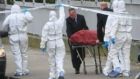 The body of Kieran Farrelly is removed from Killarney Court flats off Buckingham Street, Dublin in 2014. Photograph: Gareth Chaney/Collins