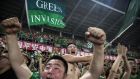 Fans of Beijing Guoan display a ‘Green Invasion’ flag during a match against Chongcing Lifan FC in 2015. Photograph: Kevin Frayer/Getty Images