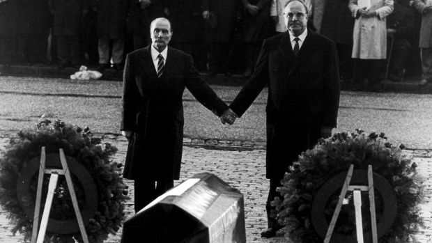 Helmut Kohl (right) stands hand in hand with former French president Francois Mitterrand during their visit to the former Verdun battlefields in 1984. File photograph: Reuters