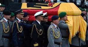 The coffin of late former chancellor Helmut Kohl during military honors after a Mass at the cathedral in Speyer. Photograph: Amelie Querfurth/AFP/Getty Images
