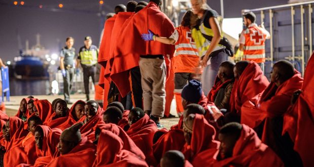 A group of 52 migrants who were rescued  by the Spanish coastguard are met by Red Cross personnel  at Málaga harbour on June 21st. Photograph:  Guillaume Pinon/NurPhoto via Getty Images