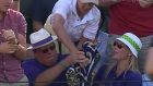 A tussle for Jack Sock’s Wimbledon towel on the second day of the 2017 Wimbledon Championships, in London, England. Photograph: Screengrab/BBC