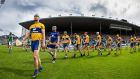 Clare’s Patrick O’Connor leads the team during the parade before the Munster senior hurling championship semi-final against Limerick. Photograph: Cathal Noonan/Inpho
