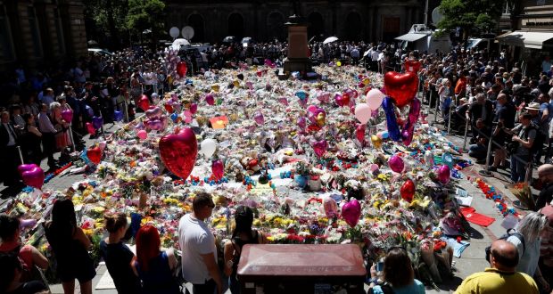 People look at tributes to the victims of the attack on the Manchester Arena. File photograph: Stefan Wermuth/Reuters