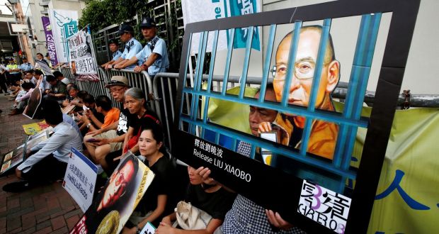 Pro-democracy activists stage a sit-in protest demanding the release of Nobel laureate Liu Xiaobo, outside China’s Liaison Office in Hong Kong. Photograph: Bobby Yip/Reuters
