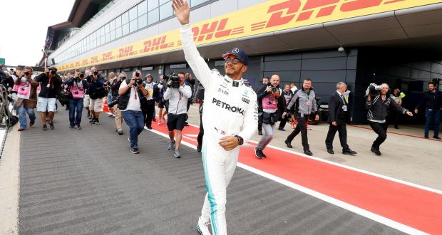 Lewis Hamilton celebrates finishing in pole position in the British Grand Prix. Photograph: Martin Rickett/PA