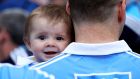  Kevin McManamon with his seven-month-old  nephew Liam after Dublin won their seventh straight Leinster football title at Croke Park on Sunday. Photograph:  Tommy Dickson/Inpho