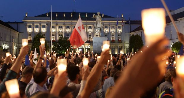 Protesters gather in front of the Presidential Palace in Warsaw on Monday during a peaceful protest against judicial reforms Photograph: Reuters 