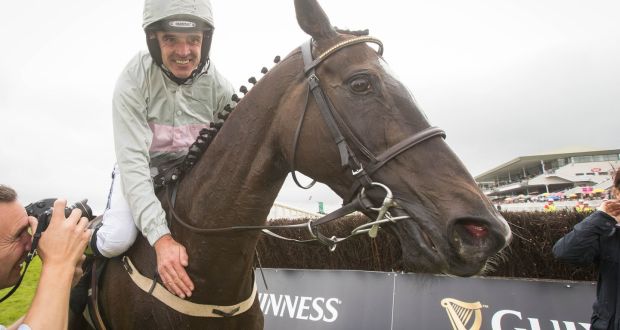 Ruby Walsh celebrates Clondaw Warrior’s victory in the Galway Hurdle last year at Ballybrit. Photograph: Ryan Byrne/Inpho