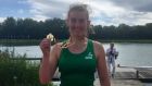 Ireland’s Georgia O’Brien shows off her gold medal after winning the women’s single sculls at the Coupe de la Jeunesse in Belgium.
