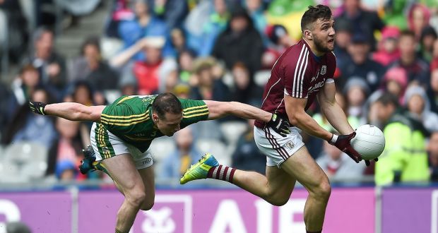 Galway’s Damien Comer breaks through the challenge of Kerry’s  Mark Griffin during the All-Ireland quarter-final at Croke Park. Photograph: Tommy Grealy/Inpho
