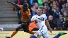 Middlesbrough’s Ben Gibson (right) and Wolverhampton Wanderers’ Bright Enobakhare battle for the ball during the Sky Bet Championship match at Molineux. Photograph:  Nick Potts/PA Wire