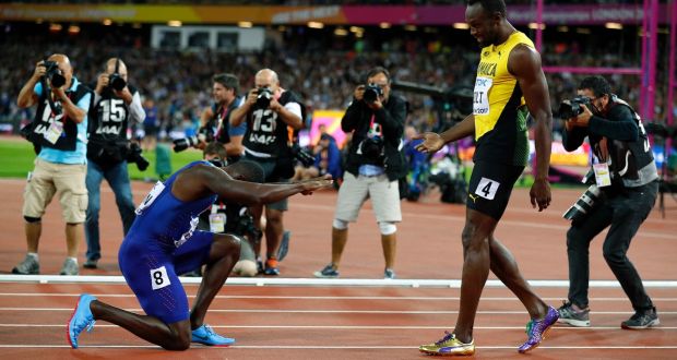 Justin Gatlin bows down to Usain Bolt after the men’s 100m final at the World Athletics Championships in London. Photo: Phil Noble/Reuters