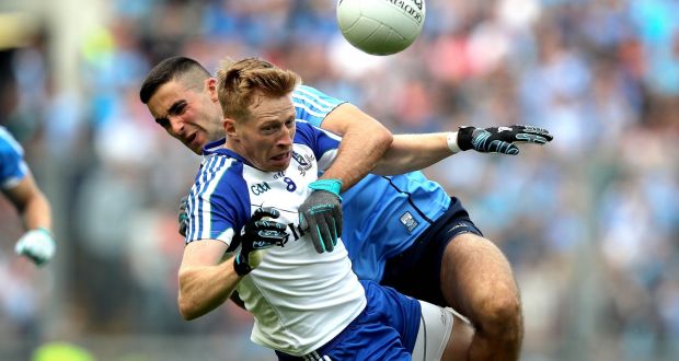 Dublin’s James McCarthy and Kieran Hughes of Monaghan in action during the quarter-final  at Croke Park. Photograph: Ryan Byrne/Inpho 