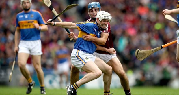 Galway’s Johnny Coen tackles  Michael Cahill of Tipperary during the All-Ireland hurling semi-final at Croke Park. Photograph: Ryan Byrne/Inpho 