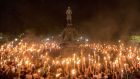 Torch-bearing white nationalists rally around a statue of Robert E Lee, the Confederate general, near the University of Virginia campus in Charlottesville. Photograph: Edu Bayer/The New York Times