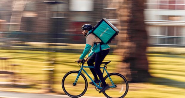 A Deliveroo worker goes about his business. As the law tries to catch up with the technology, a couple of companies dig their heels in – Air BnB, Uber, Lyft, Deliveroo, TaskRabbit, Deliveroo. Photograph:  Mikael Buck/Deliveroo